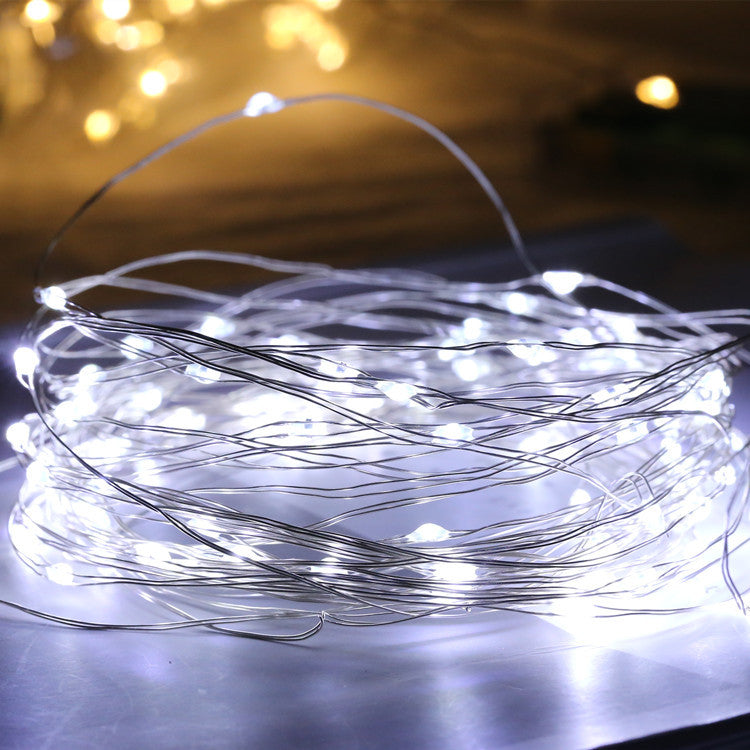 Glass bottle with gypsophila lights